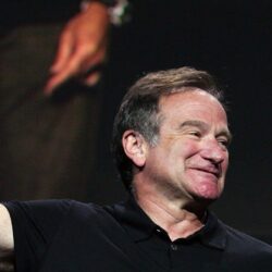 The famous Robin Williams shows his hand up wallpapers and image