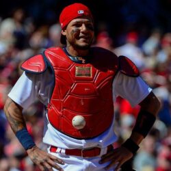 catcher Yadier Molina can’t find the ball because it’s stuck to