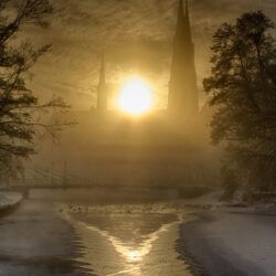 BOTPOST] ITAP of the sun rising behind Uppsala Cathedral in winter