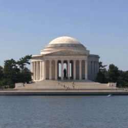 Tourists climb the steps of the Thomas Jefferson Memorial shot from