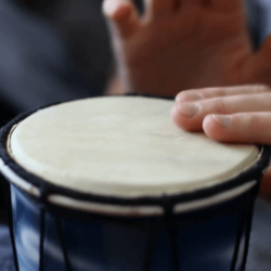 Playing Bongo drum close up HD stock footage. Hand tapping a Bongo