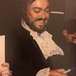 Luciano Pavarotti signs autographs backstage after a performance of