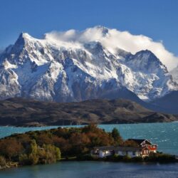 Patagonia Chile sky clouds mountains snow lake house trees nature