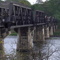 Vistors walk the famous Bridge on the River Kwai, in Kanchanaburi