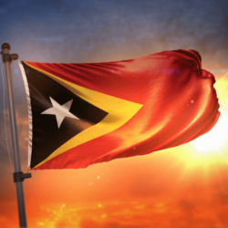 East Timor Flag Backlit At Beautiful Sunrise Loop Slow Motion 4K