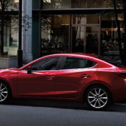 2019 Mazda 3 red color on road in city 4k hd wallpapers