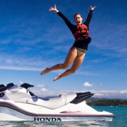 High Definition Wallpapers Of A Woman Jumping Out Of A Jetski