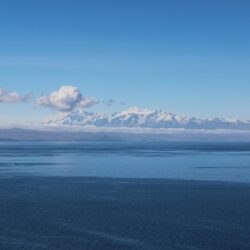 sea mountains blue lake lake titicaca titicaca clouds clear sky