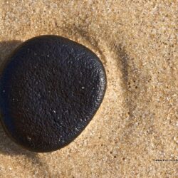 Black Pebble on a Beach Beach Backgrounds Wallpapers