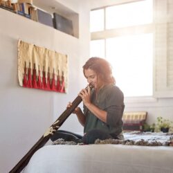 Alternative Unusual Musical Instrument Didgeridoo Player At Home