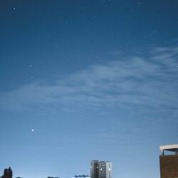 Download wallpapers night city, starry sky, buildings, sky