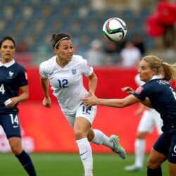 Lucy Bronze of England is challanged by Amandine Henry of France