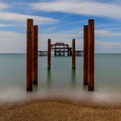 Brown wooden pillar on body of water, brighton HD wallpapers
