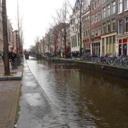 red light district in amsterdam canal day