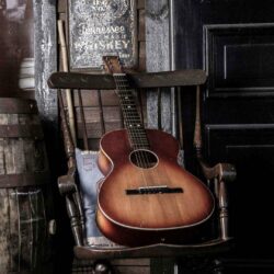 Old Guitar On Chair