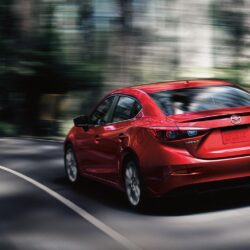 2019 Mazda 3 red color rear back side view on highway in forest 4k