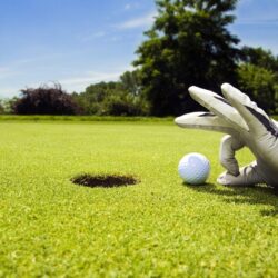 hand glove push golf ball into hole field wide hd wallpapers
