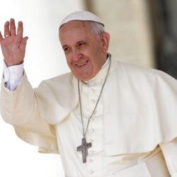 Pope Francis waves as he leads his weekly audience in Saint Peter’s