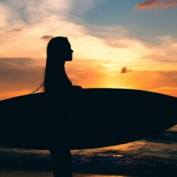 Girl Surfing in Sea Sunset Wallpapers