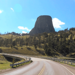 POV driving Devils Tower a National Monument in Wyoming USA Stock