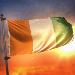 Ivory Coast Flag Backlit At Beautiful Sunrise Loop Slow Motion 4K