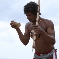 Brazilian playing Berimbau Instrument in Salvador, Bahia, Brazil