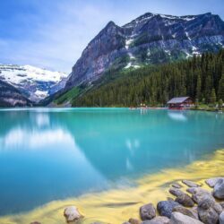 Amazing turquoise water lake guarded by rocky mountains wallpapers