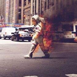 Astronaut on Fire walking down a street : wallpapers