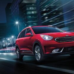 2019 Kia Niro EV red color night on road in city lights backgrounds
